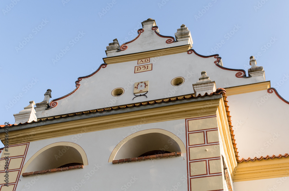 Naklejka premium Old church facade against blue clear sky