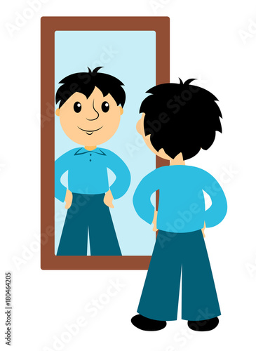 Foto The boy looks in a mirror