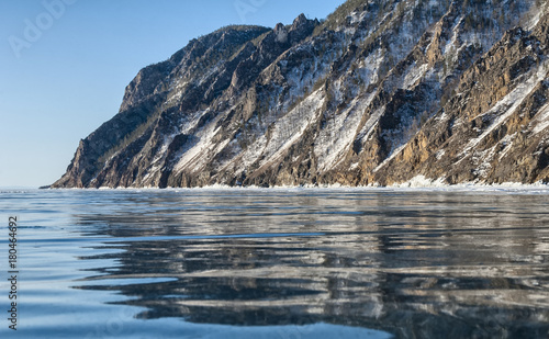 Перевести вGoogleBingtransparent ice of lake Baikal and the reflection of the rockstransparent ice of lake Baikal and the reflection of the rocks