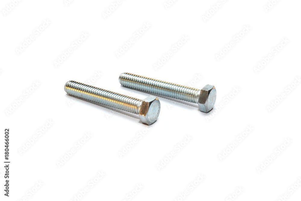 Bolt and nut on a white background.Selective focus. Bolt and nut on a white background.Selective focus.