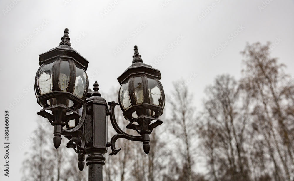 Vintage black lantern on a city street
