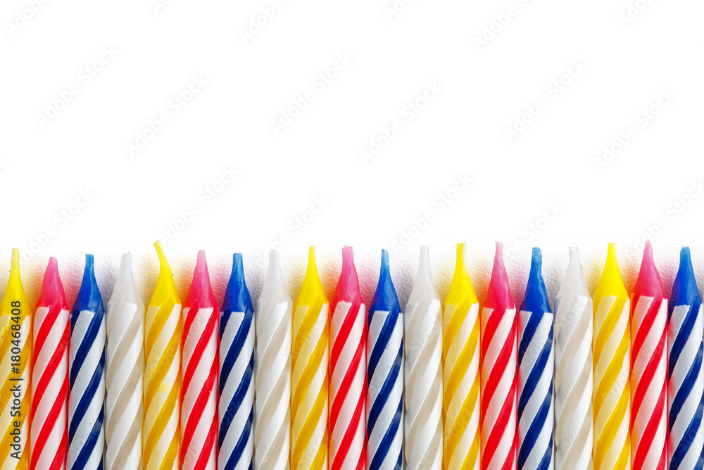 holiday candles lined up in a row on a white background isolate