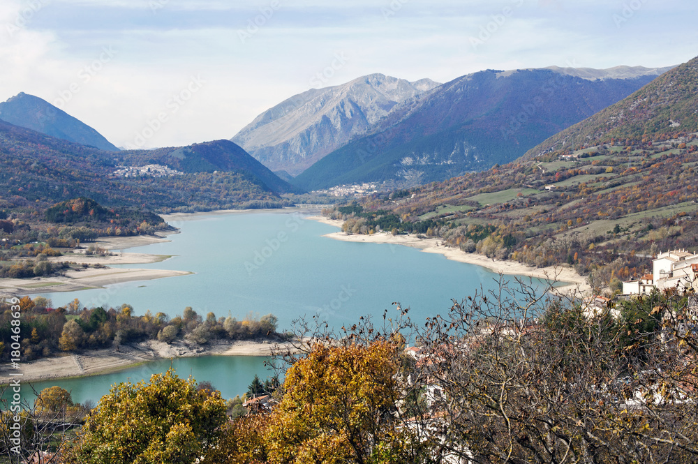 Barrea lake with the namesake Medieval hamlet, at the foot of Mattone Mount, in the National Park of Abruzzo, Italy