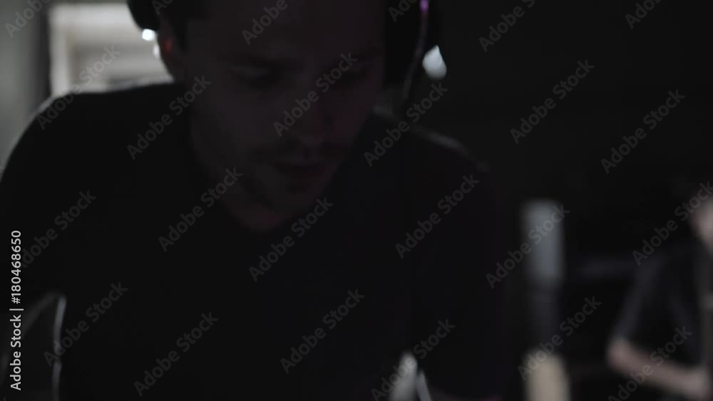 Club dj team scratching vinyl records on stage. hip hop djs playing music tracks on concert in the night club with drum sticks on pad. Dj scratch vinyl record. Beat maker play music on beat machine