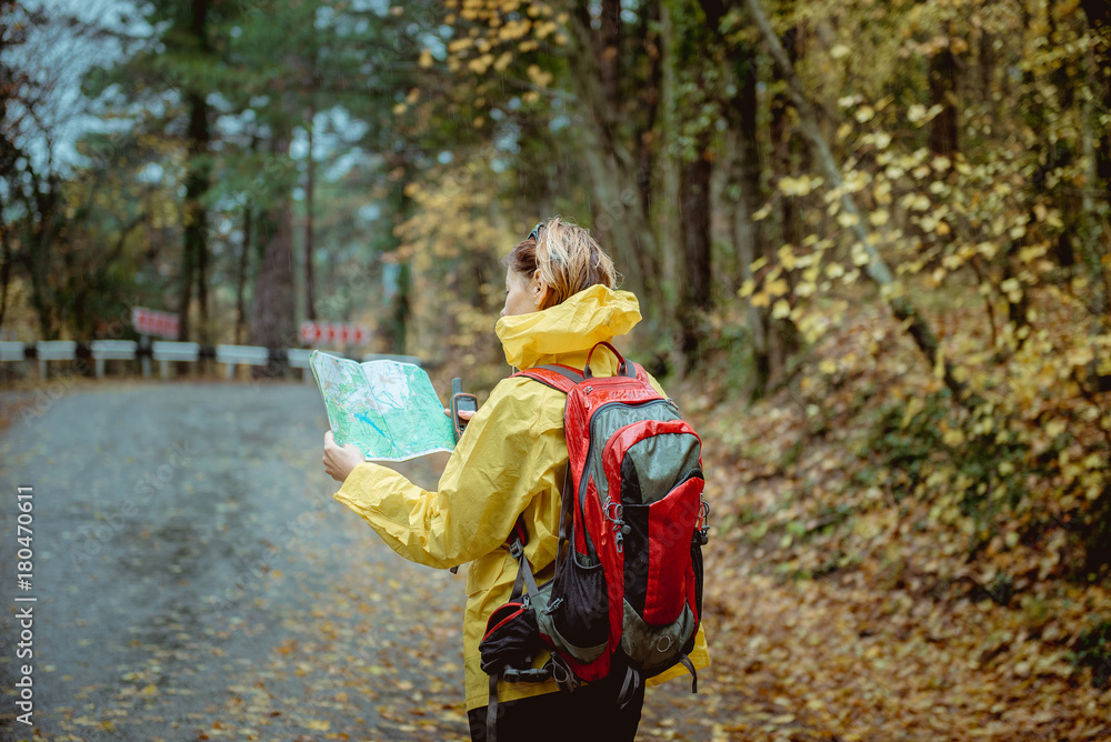 girl tourist with a backpack in the autumn forest girl tourist with a backpack in the autumn forest
