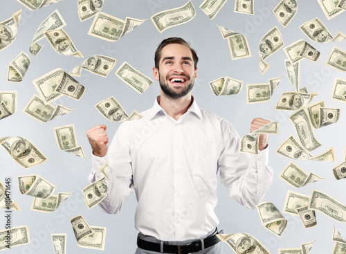 Young man with money on gre...