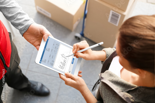 Woman appending signature a...