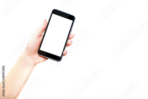 Phone in hands held from down. A woman is holding a black phone with a blank screen in her hand. Possible to complete mobile phone content. Online shop. Online shopping, content on your smartphone.
