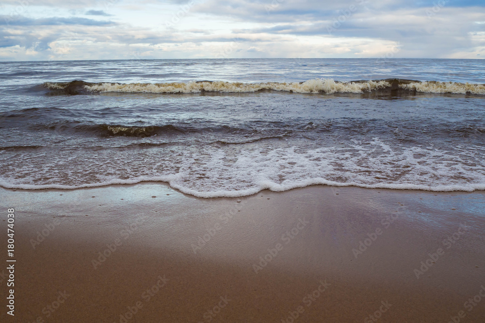 Landscape of sea to the horizon. The natural elements water Ocean waves. Wild sea storm - hazardous weather. The waves lapping on the shore. 