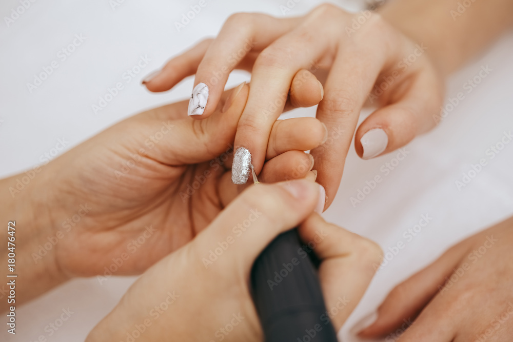 Manicurist with a milling cutter for manicure Manicurist with a milling cutter for manicure