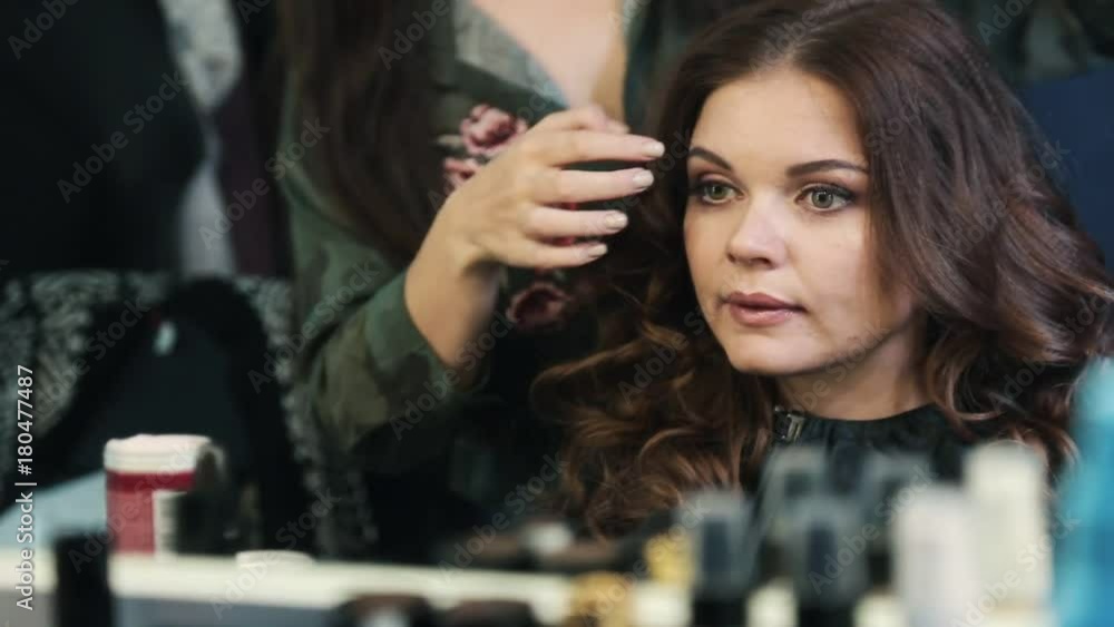 Hairdresser makes hairstyle beautiful girl Hairdresser makes hairstyle beautiful girl