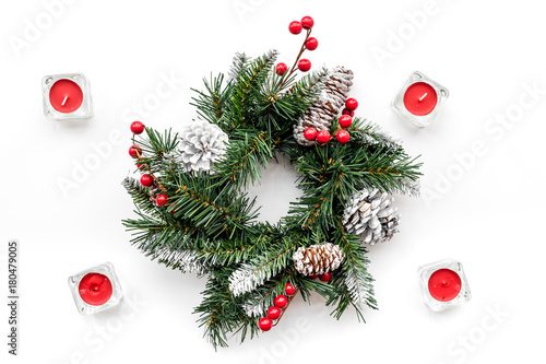 Christmas decorations. Wreath and toys on white background top view