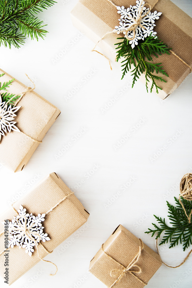 Christmas and New Year holiday background. Xmas greeting card. Christmas gifts on white wooden background top view. Flat lay Christmas and New Year holiday background. Xmas greeting card. Christmas gifts on white wooden background top view. Flat lay