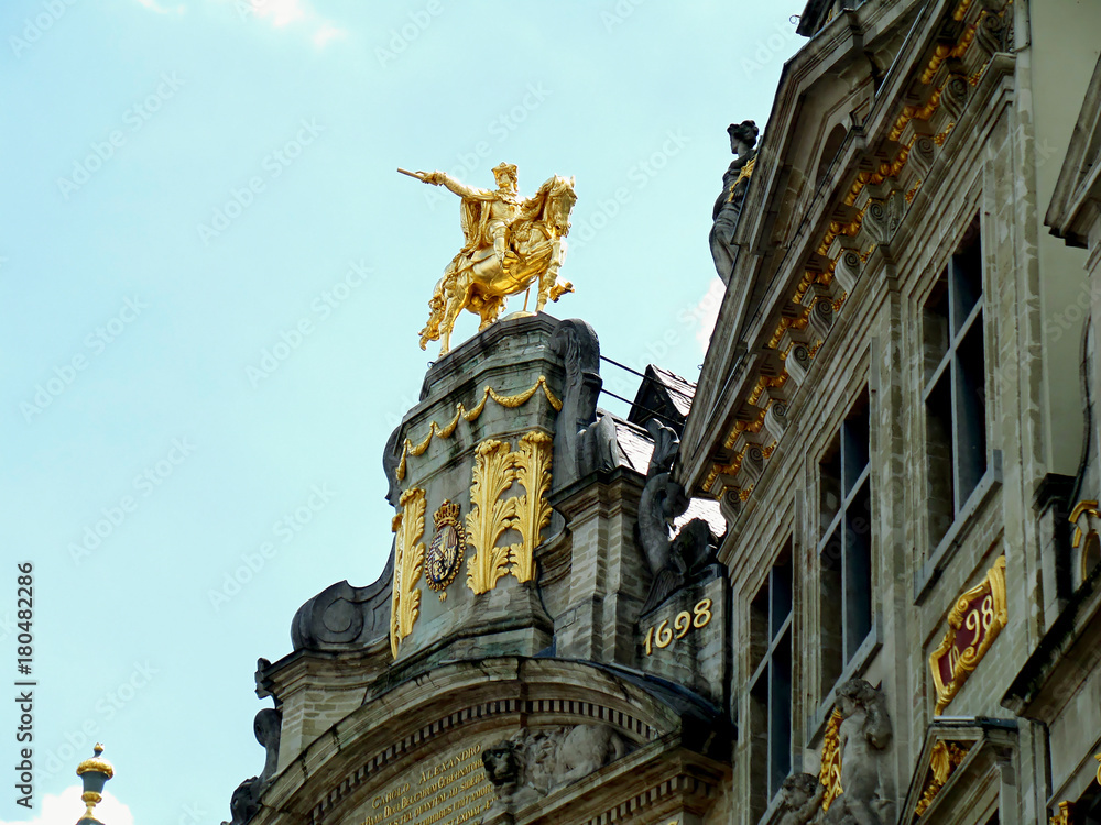 Gorgeous golden sculpture of Charles-Alexandre de Lorraine on the vintage building L'Arbre D'Oron at Grand Place in Brussels, Belgium 