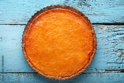 Pumpkin tart on blue wooden table