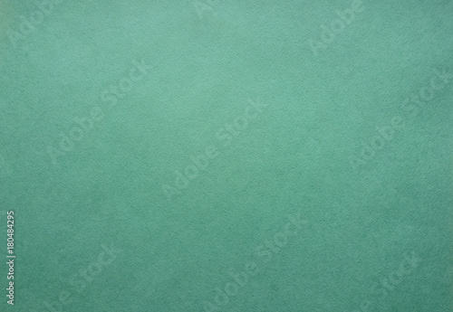 Green paper for drawing in the pastel technique. The texture of the paper. Top view, close-up 