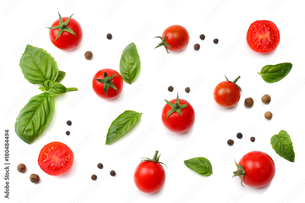 mix of slice of tomato, basil leaf, garlic and spices isolated on white background. top view mix of slice of tomato, basil leaf, garlic and spices isolated on white background. top view