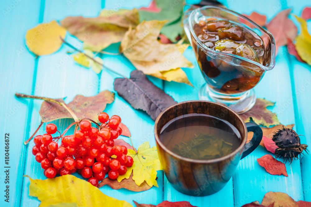 cup of tea on the table with fallen leaves cup of tea on the table with fallen leaves