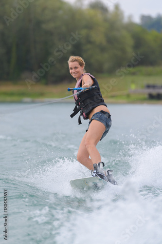 Fototapeta Naklejka Na Ścianę i Meble -  woman water skiing on a lake