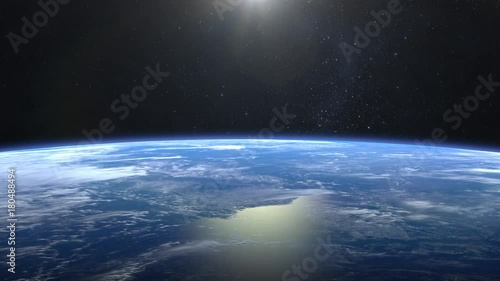 Earth from space. Flight over the Earth. 4K. Sunrise. The camera moves forward.