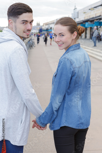young couple together on a street