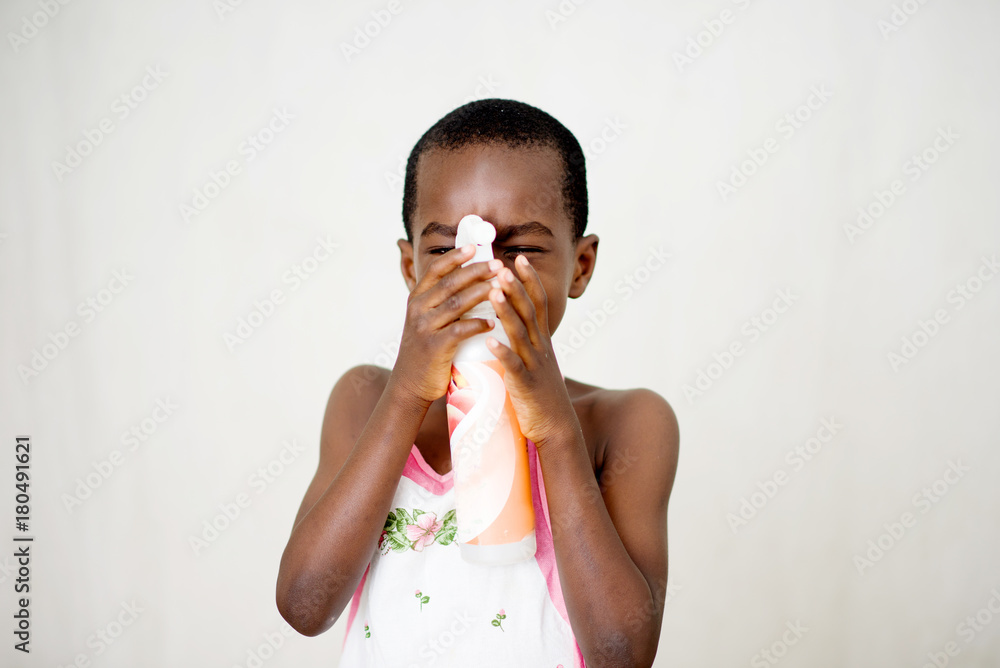 little boy playing with bottle of liquid soap little boy playing with bottle of liquid soap