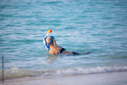 A young woman go snorkeling in the ocean