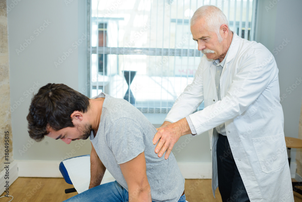 man having chiropratic massage man having chiropratic massage
