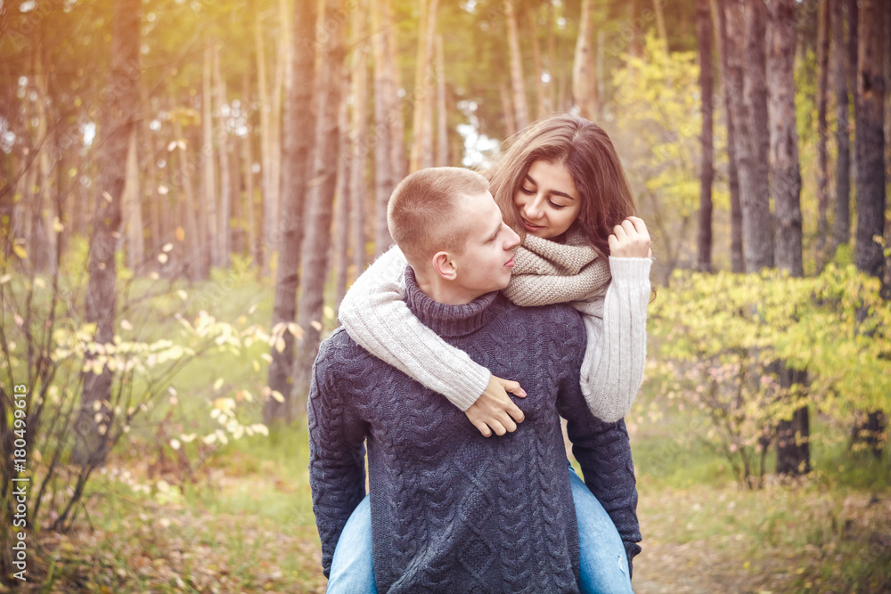 Fototapeta premium Happy young couple on nature. The concept of love. St. Valentine's Day.