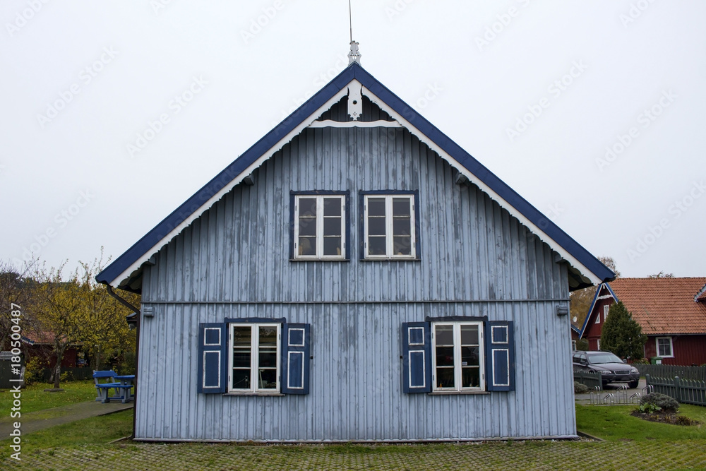 small wooden house in a beautiful village