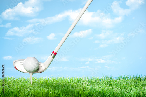 Driver about to hit the Ball: Series of golfing equipment concept pictures..Shot in studio on grass with blue background