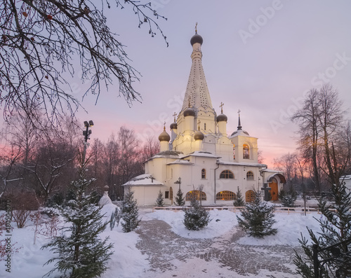 Ancient orthodox temple on a frosty evening at sunset. The Church of the Intercession of the Blessed Virgin Mary in Medvedkovo in Moscow photo