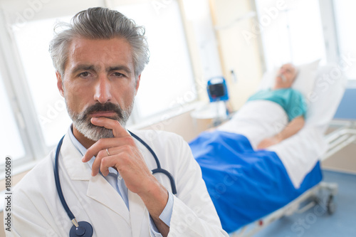 Photos doctor thinking about the mistake he made