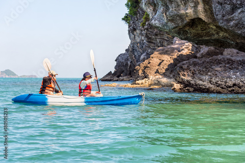 Two women are mother and daughter. Travel by boat with a kayak happy at summer around Ko Phi view the beautiful nature of the sea and island, Mu Ko Ang Thong National Park, Surat Thani, Thailand