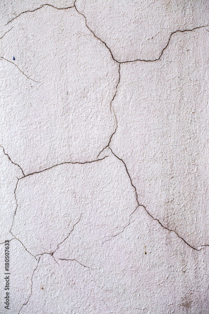 Beautiful old wall with large cracks and texture. Can be used as background Beautiful old wall with large cracks and texture. Can be used as background