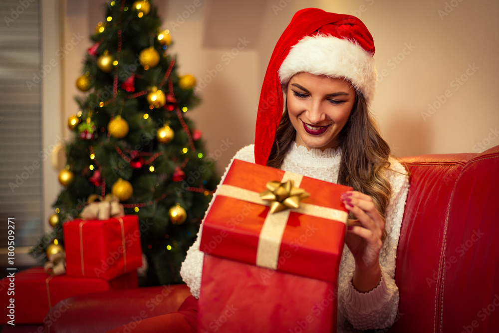 Woman opening gift box. Christmas time Woman opening gift box. Christmas time