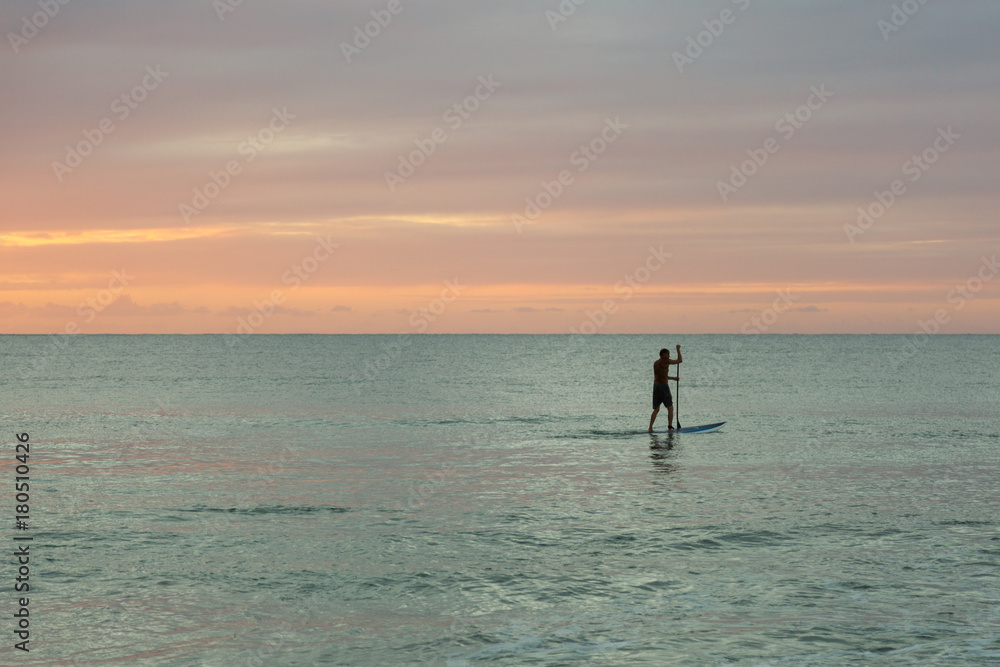 Silhouette of a standup paddler on Kauai, Hawaii