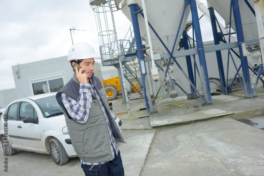 cement plant worker on the phone