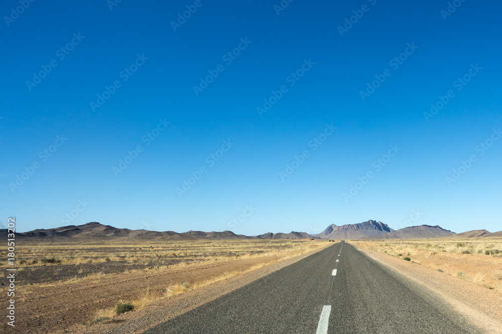 Straight road in the Sahara desert, Morocco