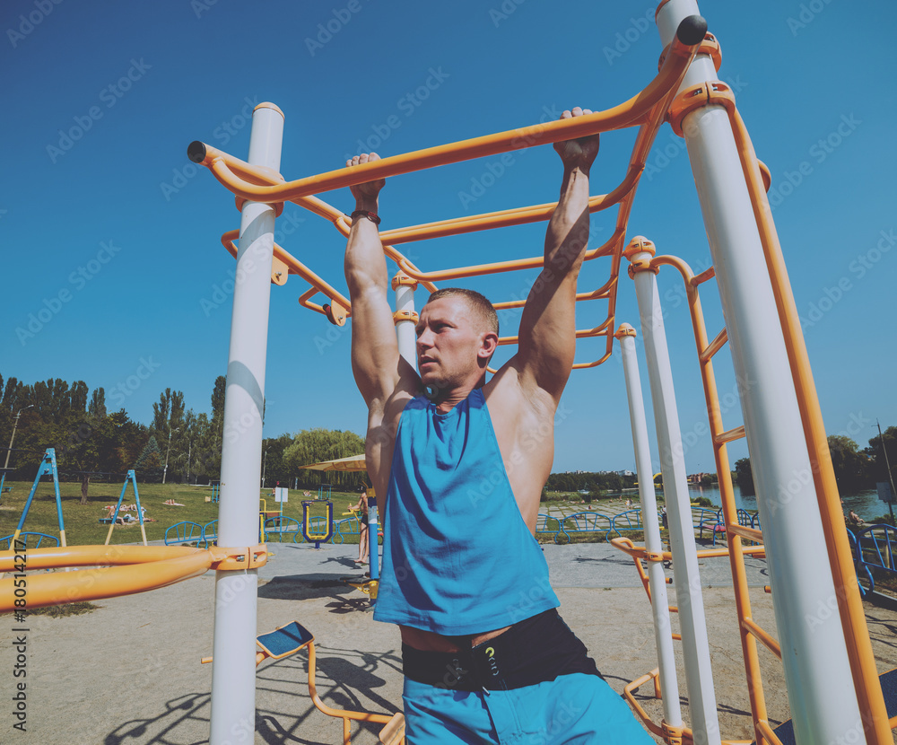 Young athlete training and doing workout outdoors in city. Young athlete training and doing workout outdoors in city.