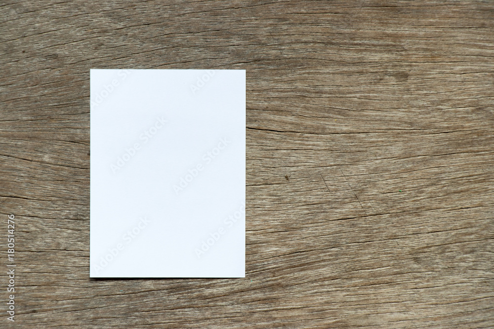 White color paper attach on wood background for remind or memo