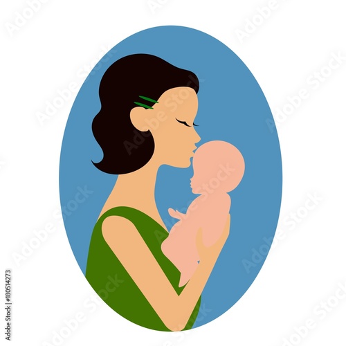 Mother holding a baby and giving him a kiss on the forehead or cheek