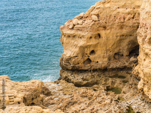 Sandcastle formation on the coast of Carvoeiro