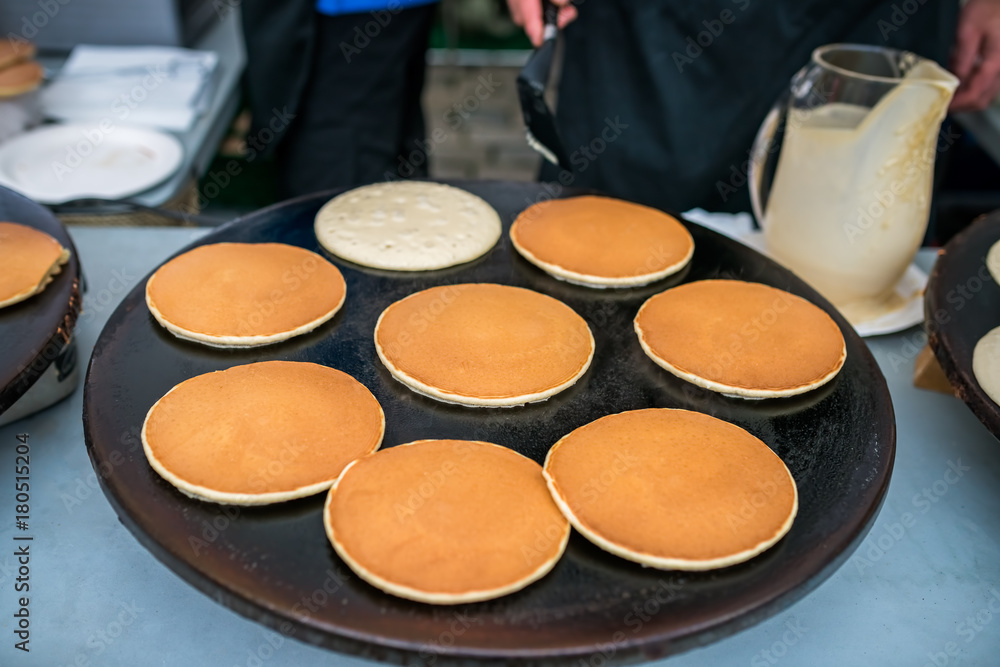 Delicious pancakes on sale on the street food market Delicious pancakes on sale on the street food market