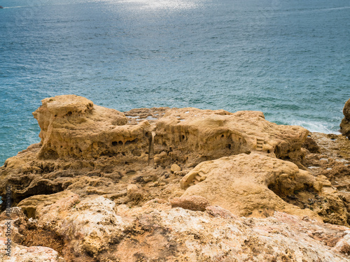 Sandcastle formation on the coast of Carvoeiro