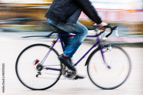 person with a racing bicycle in motion blur