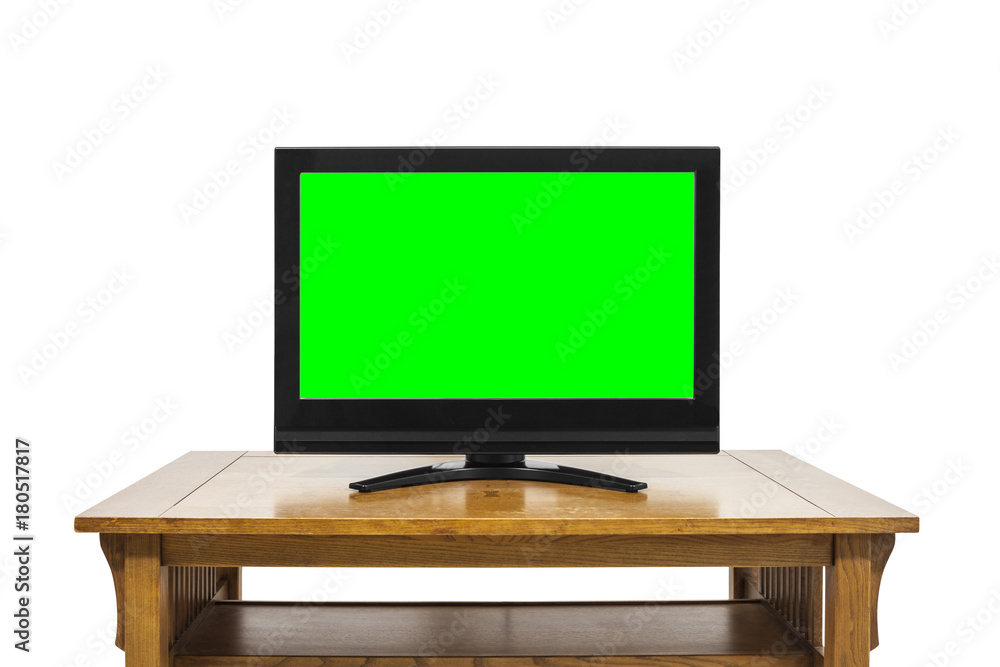 Flat Screen Television on Large Wood Table Isolated on White with Chroma Key Green Screen Flat Screen Television on Large Wood Table Isolated on White with Chroma Key Green Screen