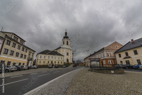 Stity town with church in dark autumn day