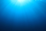 Abstract underwater blue background and sunlight