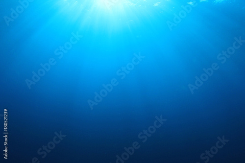 Abstract underwater blue background and sunlight